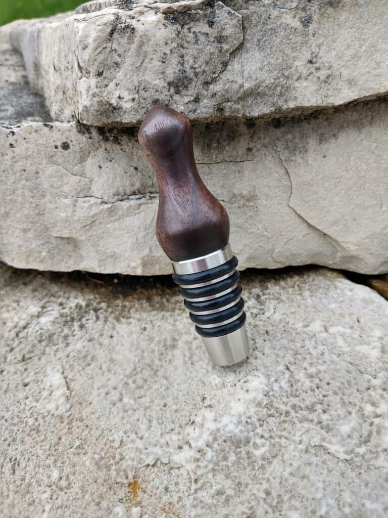 This Stainless Steel Whiskey Bottle Stopper in Flamed Walnut is made with love by Blackbear Designs! Shop more unique gift ideas today with Spots Initiatives, the best way to support creators.