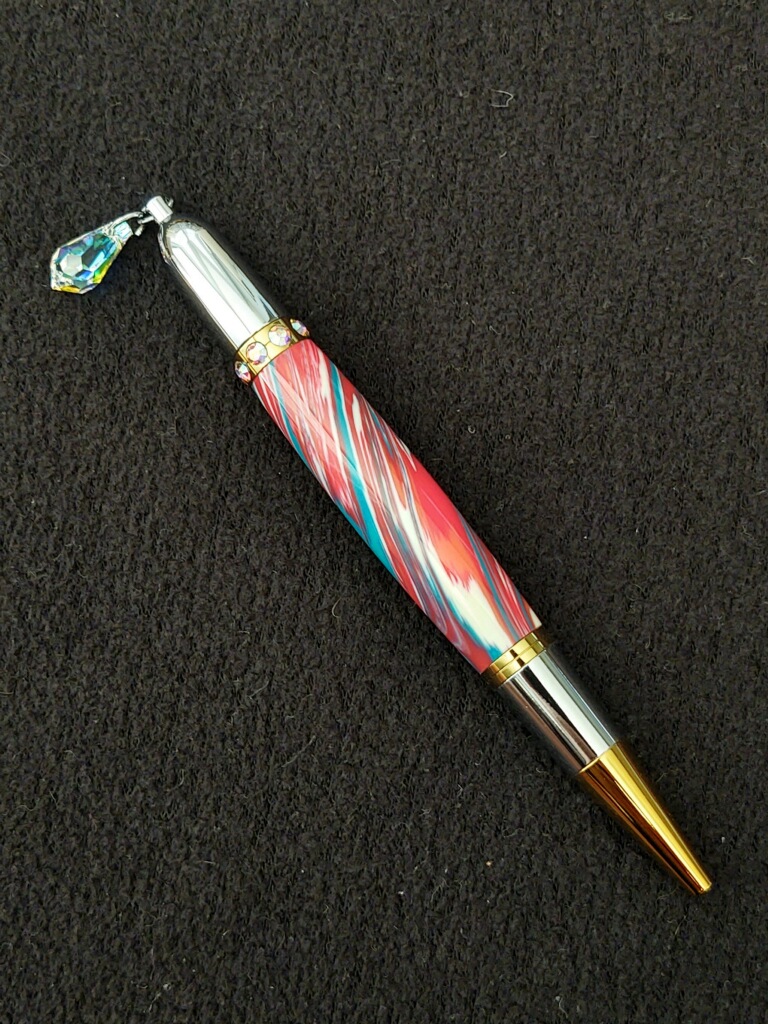 This Red & Aqua Swirl Diva Charm Pen is made with love by Blackbear Designs! Shop more unique gift ideas today with Spots Initiatives, the best way to support creators.
