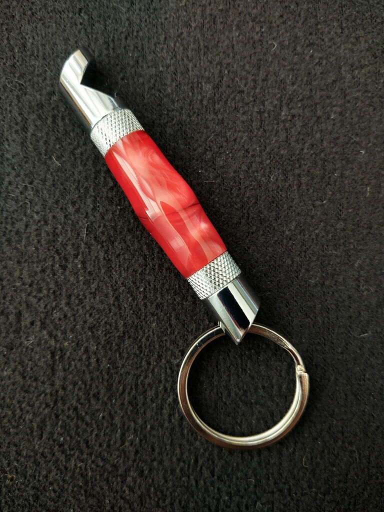 This Red Acrylic Bottle Opener Keychain is made with love by Blackbear Designs! Shop more unique gift ideas today with Spots Initiatives, the best way to support creators.